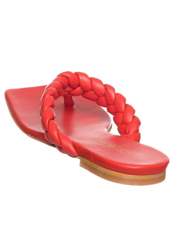 A pair of trend-setting red open toe sandals that are chic, stylish, and fashion-forward.