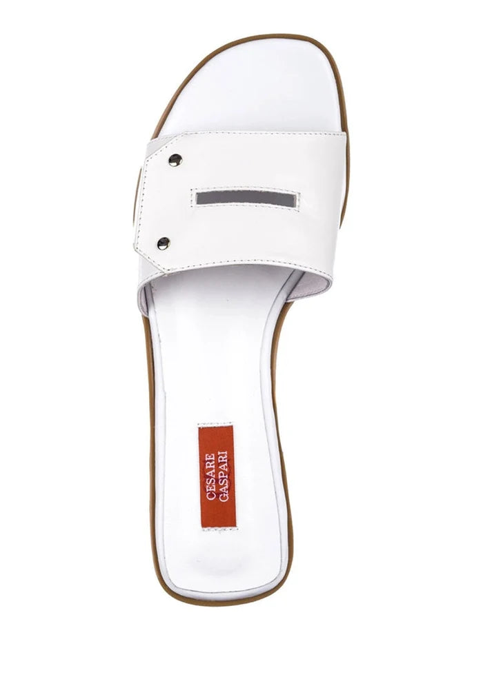 A close-up image of a pair of elegant white sandals, perfect for a chic and stylish look.
