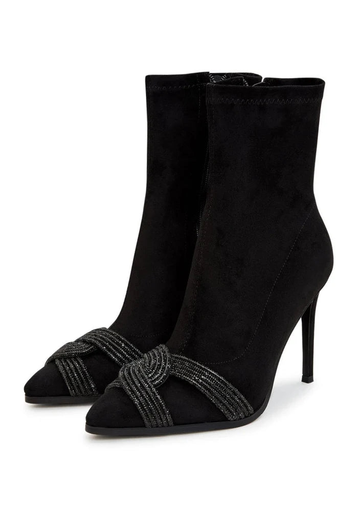 A pair of stylish suede ankle booties, a must-have for any chic and trendy footwear collection.