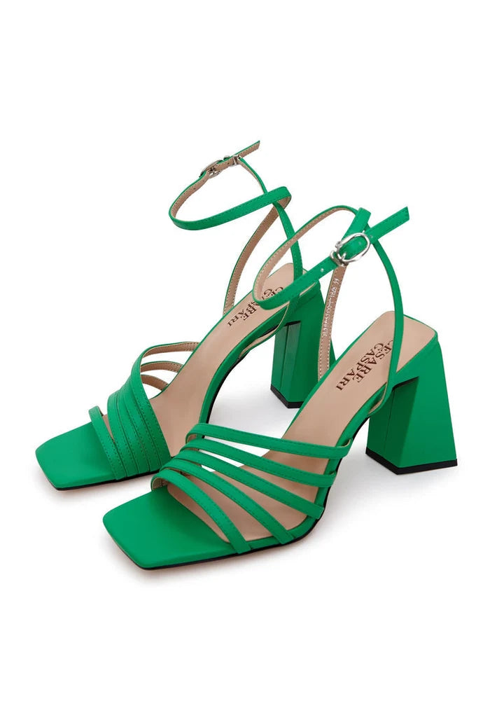 A stylish pair of chunky comfort green sandals, perfect for summer with their trendy design and comfortable fit.