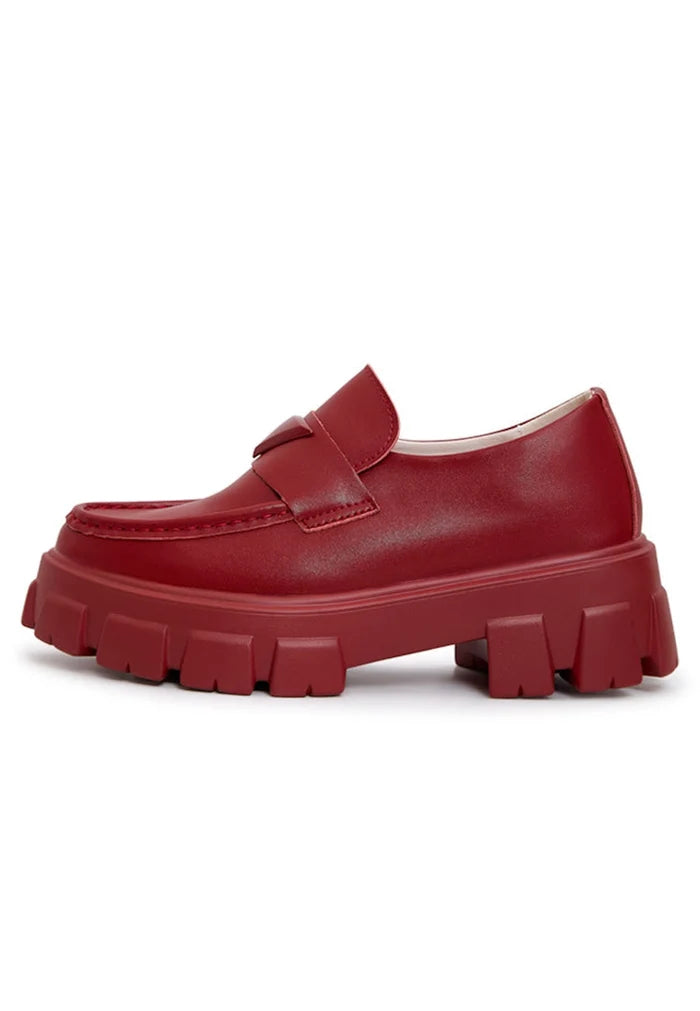 A stylish pair of chunky leather platform loafers in rich Bordeaux color - perfect for on-the-go chic comfort.