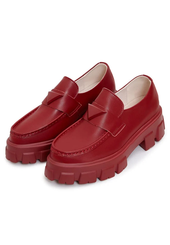 A stylish pair of chunky leather platform loafers in Bordeaux color, perfect for adding a fashion-forward touch to any outfit.