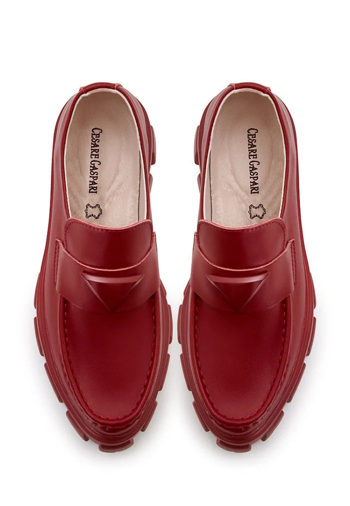 A stylish pair of chunky leather platform loafers in bordeaux, perfect for a trendy and comfortable look.