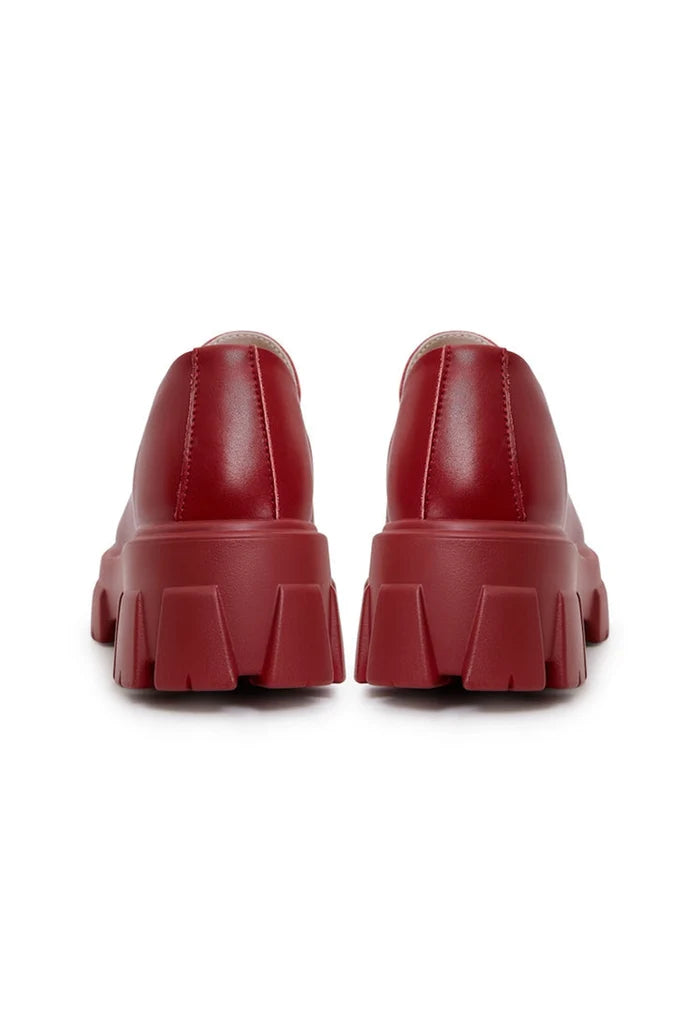 A pair of trendy chunky leather platform loafers in a rich Bordeaux color, perfect for a stylish and comfy look.
