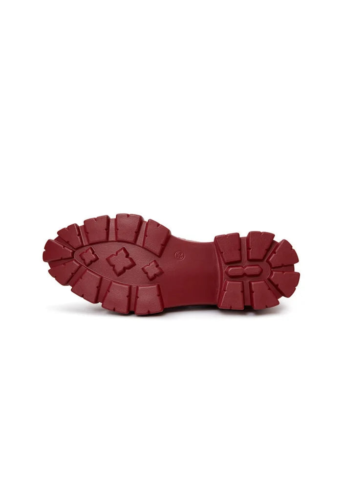 A stylish pair of chunky leather platform loafers in a rich bordeaux hue, perfect for a fashionable and comfortable look.