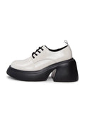 A stylish pair of white chunky loafers, perfect for adding a trendy touch to any outfit.