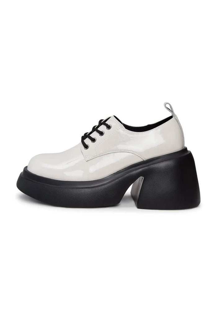 A stylish pair of white chunky loafers, perfect for adding a trendy touch to any outfit.