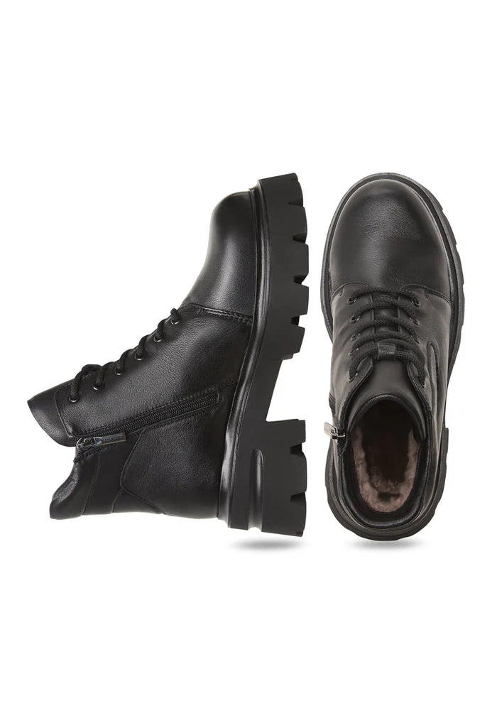 A stylish pair of black leather platform ankle boots with chunky heels, known as Freya boots.