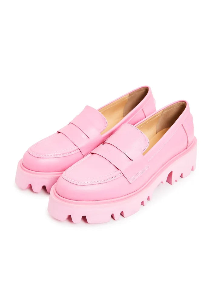 A pair of trendy pink chunky platform loafers for women's footwear fashion.