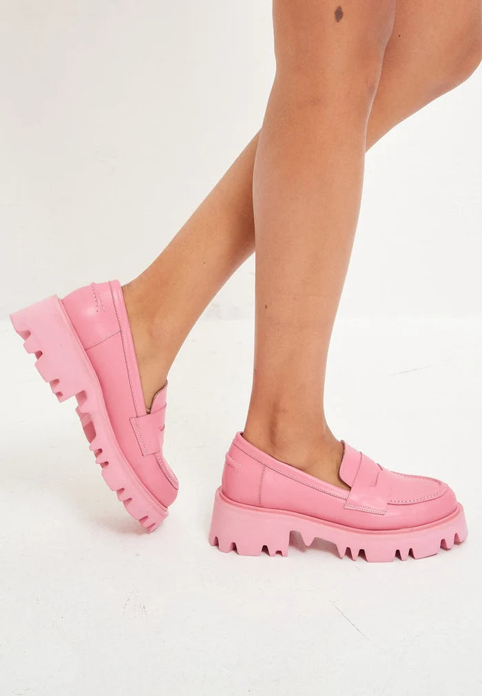 A trendy pair of pink chunky platform loafers for women's footwear fashion enthusiasts.