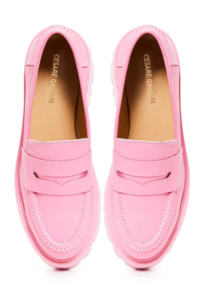 A stylish pair of chunky platform loafers in pink, perfect for trendy women's footwear fashion.