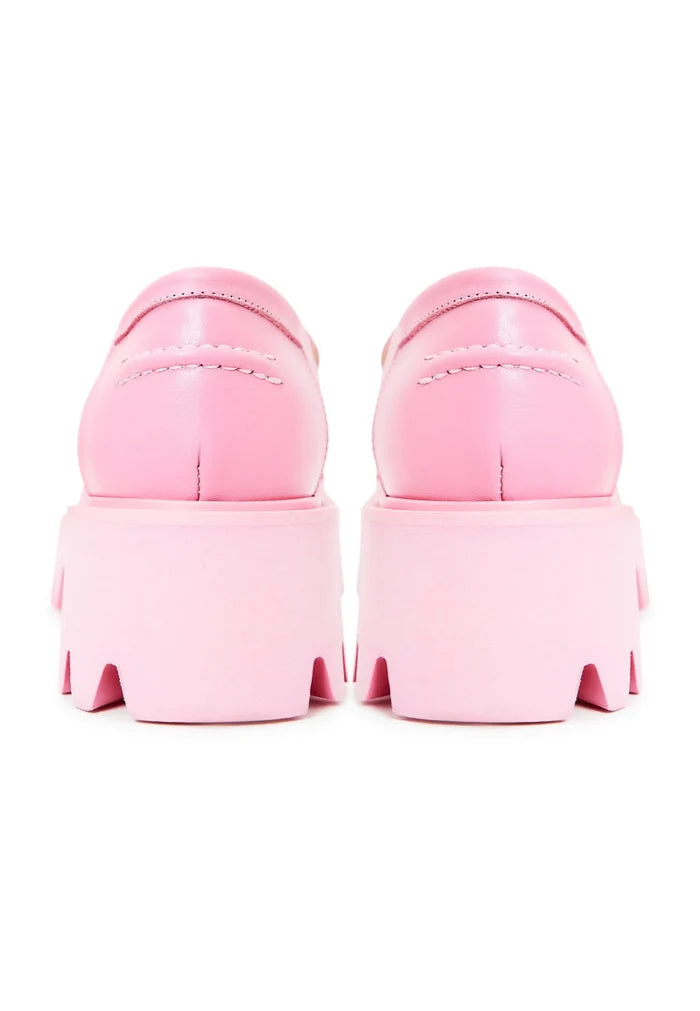 A pair of trendy chunky platform loafers in pink, ideal for stylish women's footwear fashion.