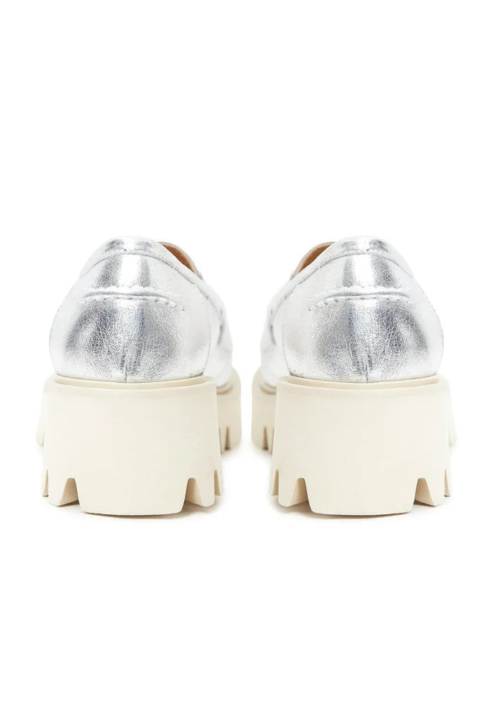 A trendy pair of chunky platform loafers in silver, perfect for fashion-forward women.
