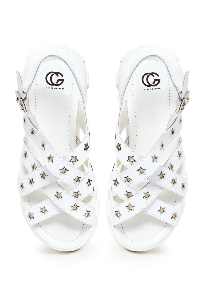 A stylish pair of women's chunky white platform sandals with a trendy chunky heel design.