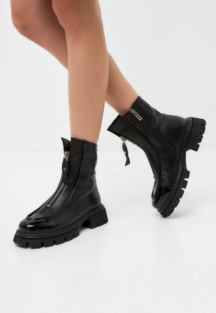 A stylish pair of black Jaq ankle boots with chunky silhouette and edgy zipper detail.