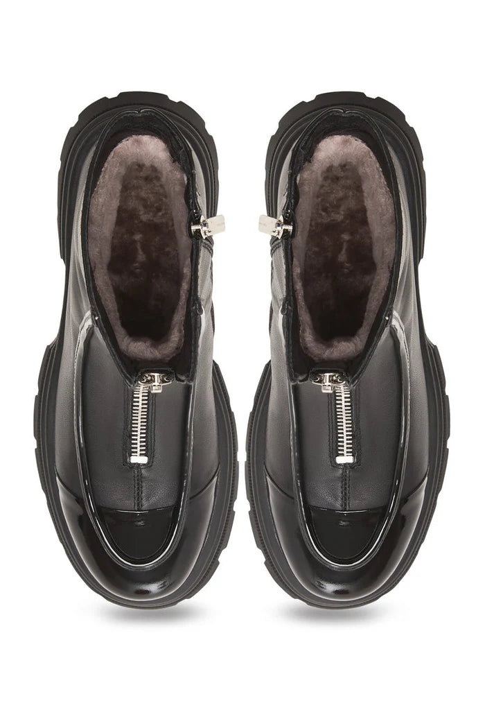 A stylish pair of black chunky zipper ankle boots featuring a sleek design, perfect for any outfit.