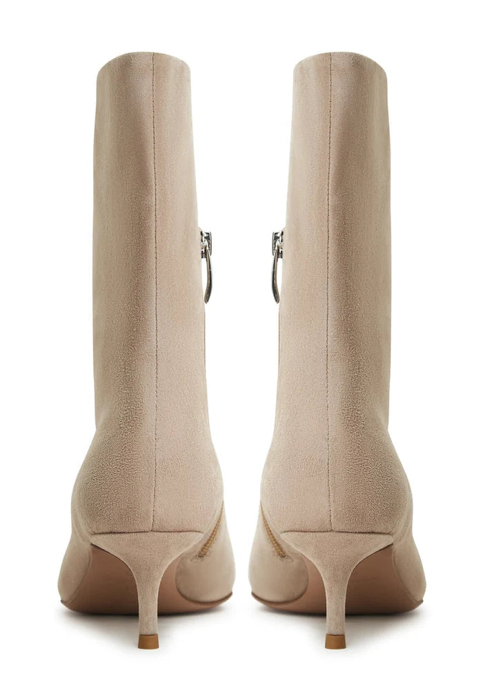 A pair of stylish Regina beige ankle boots, perfect for women who love classic fashion and designer footwear trends.