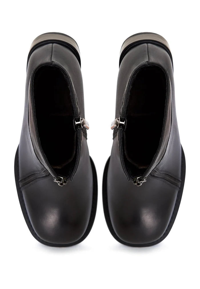 A pair of vintage-style block heel ankle boots, perfect for a retro look.