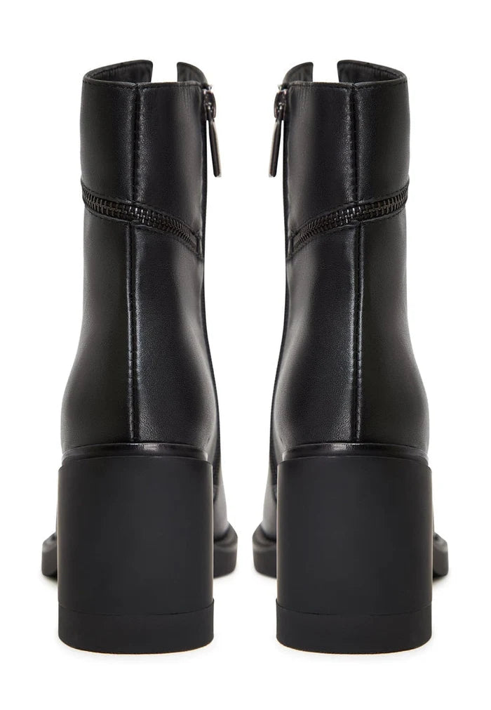 A pair of stylish vintage-style block heel ankle boots, perfect for a classic and retro look.