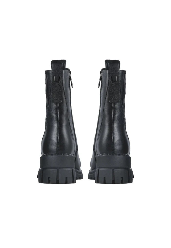 A stylish pair of women's block heeled boots, a classic and fashionable choice with a high heel.