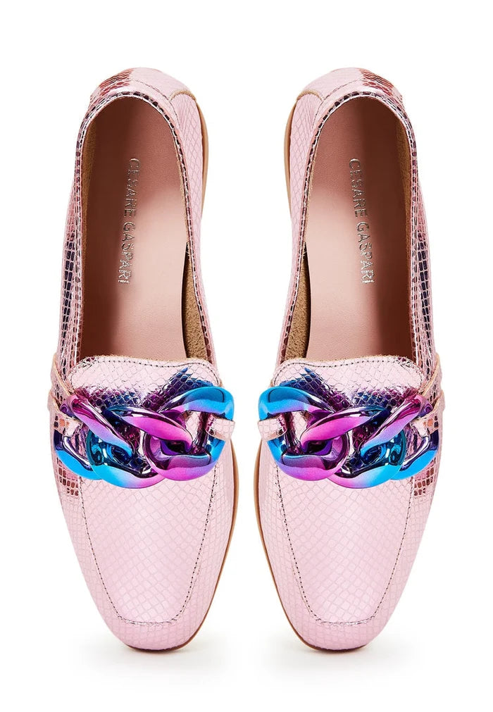 A pair of classic style leather loafers in metallic pink, women's fashion shoes with a flat sole design.