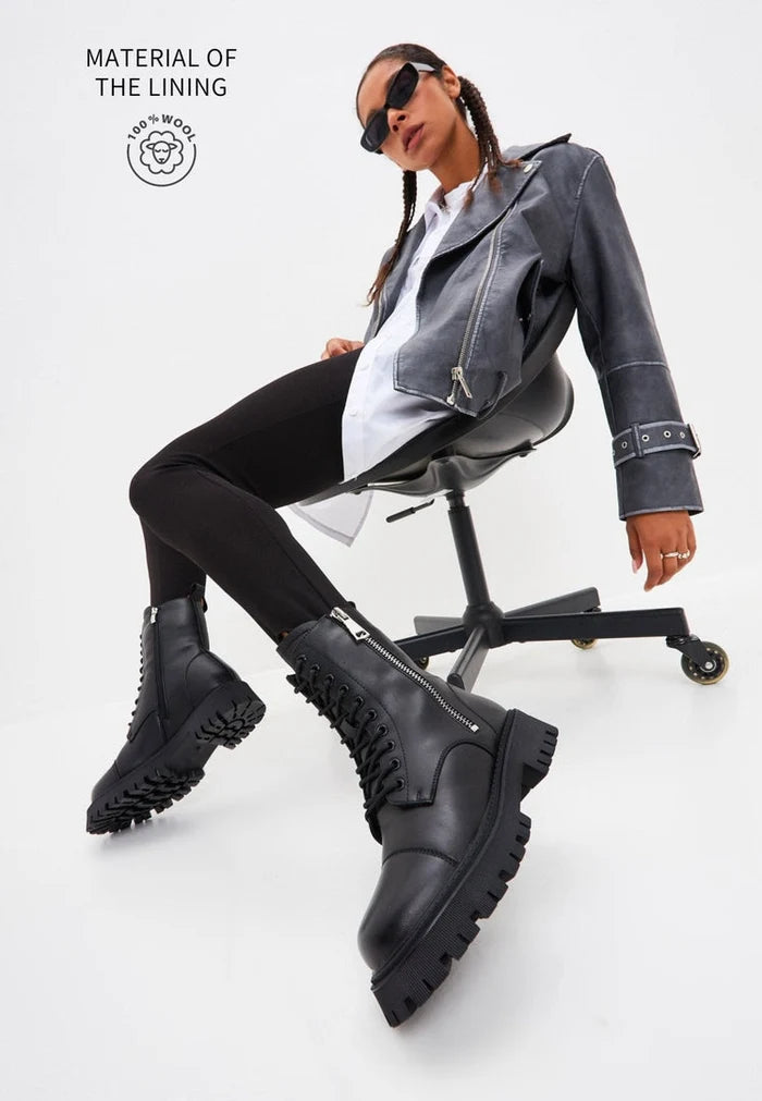 A stylish pair of black leather platform boots, classic ankle boots, and platform ankle booties for women.