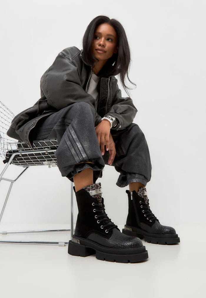 A stylish image of Luna ankle boots in black suede, featuring a platform heel design - perfect for a classic and trendy look.