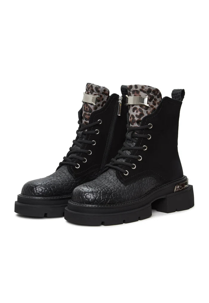 A pair of stylish Luna ankle boots in black suede with platform heels, perfect for adding a touch of elegance to any outfit.