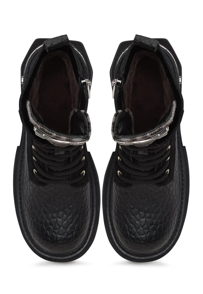 A pair of Luna ankle boots in black suede, featuring platform heels and classic leather detailing.