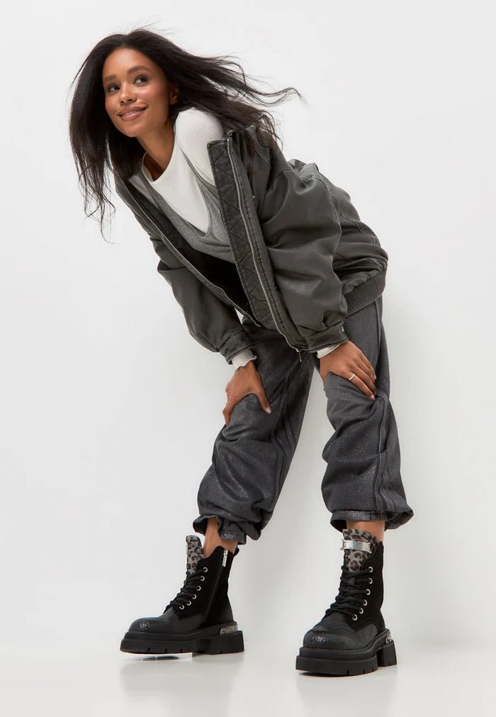 A stylish pair of Luna black suede ankle boots with platform heels, perfect for a modern twist on classic leather boots.