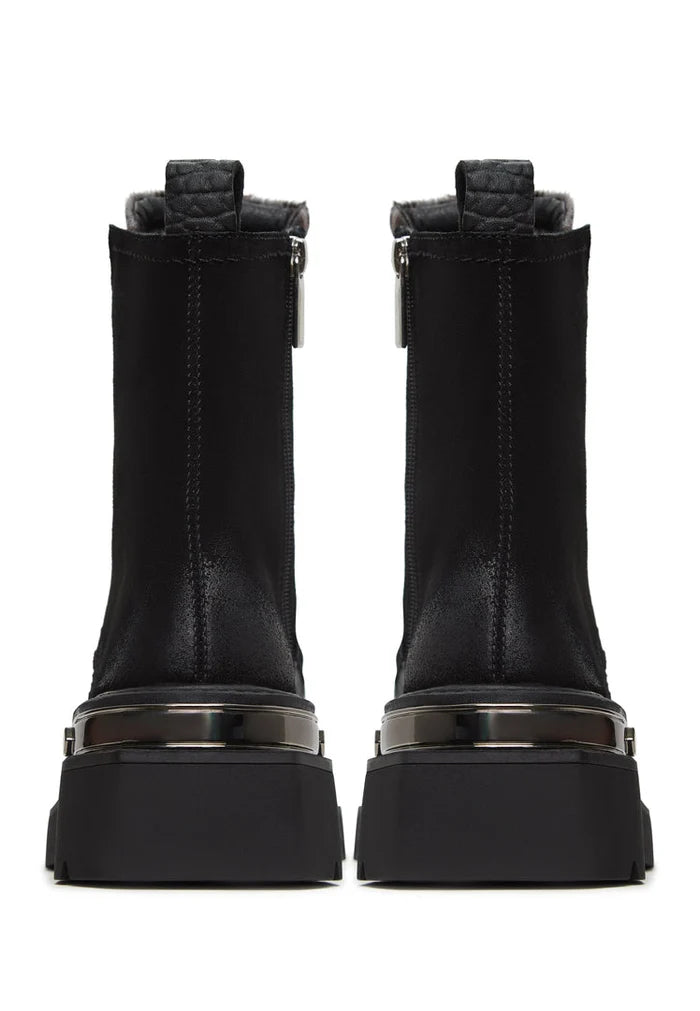 A stylish pair of Luna ankle boots in black suede with a platform heel, perfect for adding a touch of edge to any outfit.