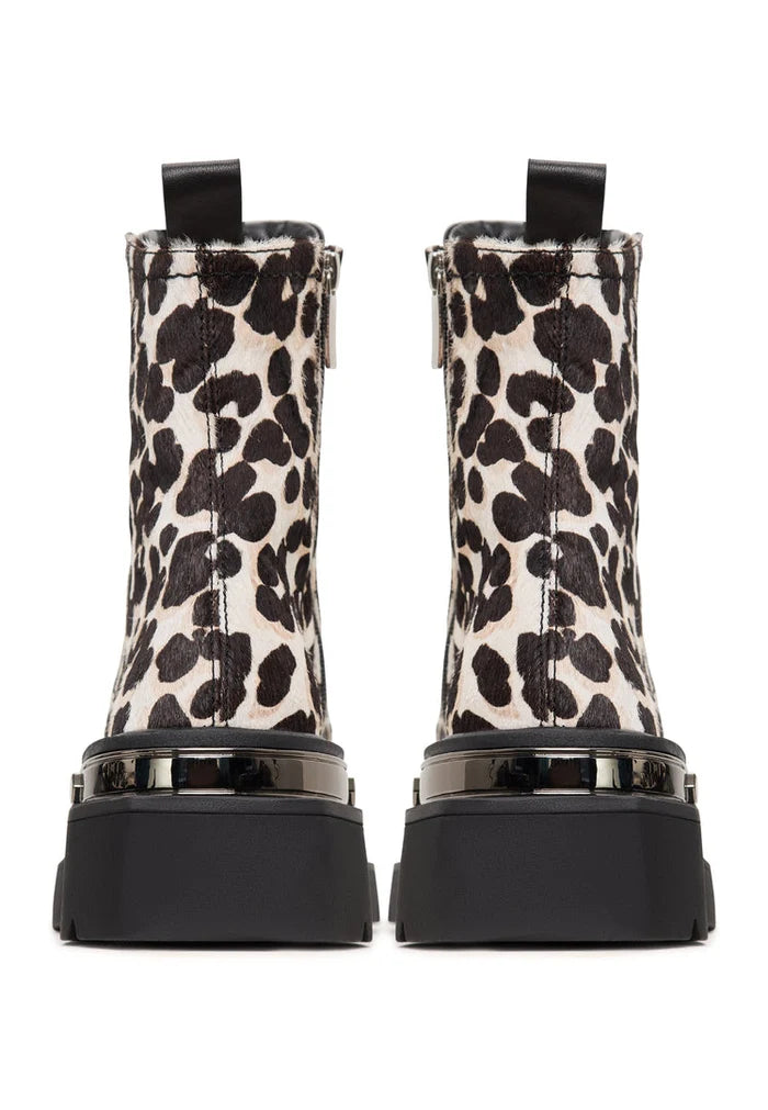 A stylish pair of classic leather platform ankle boots with a trendy leopard print design, perfect for adding a bold statement to any outfit.