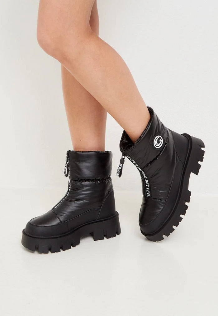 Stay cozy and chic this winter with these trendy black boots, the perfect addition to your winter fashion footwear collection.