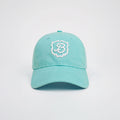 Front view of Retro Crest Cap in Lido cotton with white embroidered B crest and curved brim on light gray background