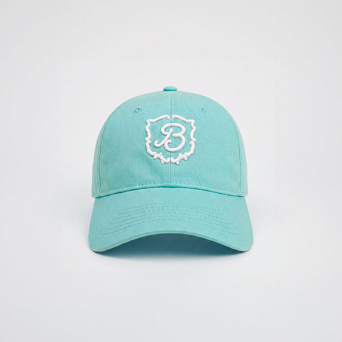 Front view of Retro Crest Cap in Lido cotton with white embroidered B crest and curved brim on light gray background