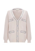 A woman wearing a cozy and stylish knit cardigan, ideal for an elegant and fashionable look.