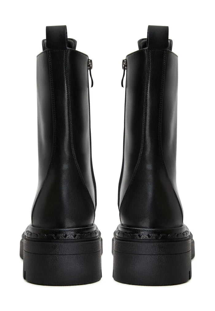A chic pair of black lace-up ankle boots, embodying elegant footwear with a stylish and fashionable appeal.