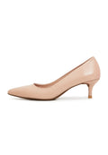 A pair of elegant beige pumps, luxe designer heels for a fashionable look.
