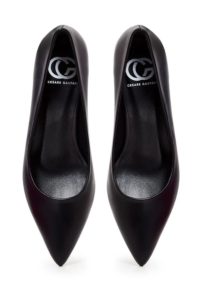 A pair of elegant black pumps, a symbol of luxury footwear with designer heels in a classic black design.