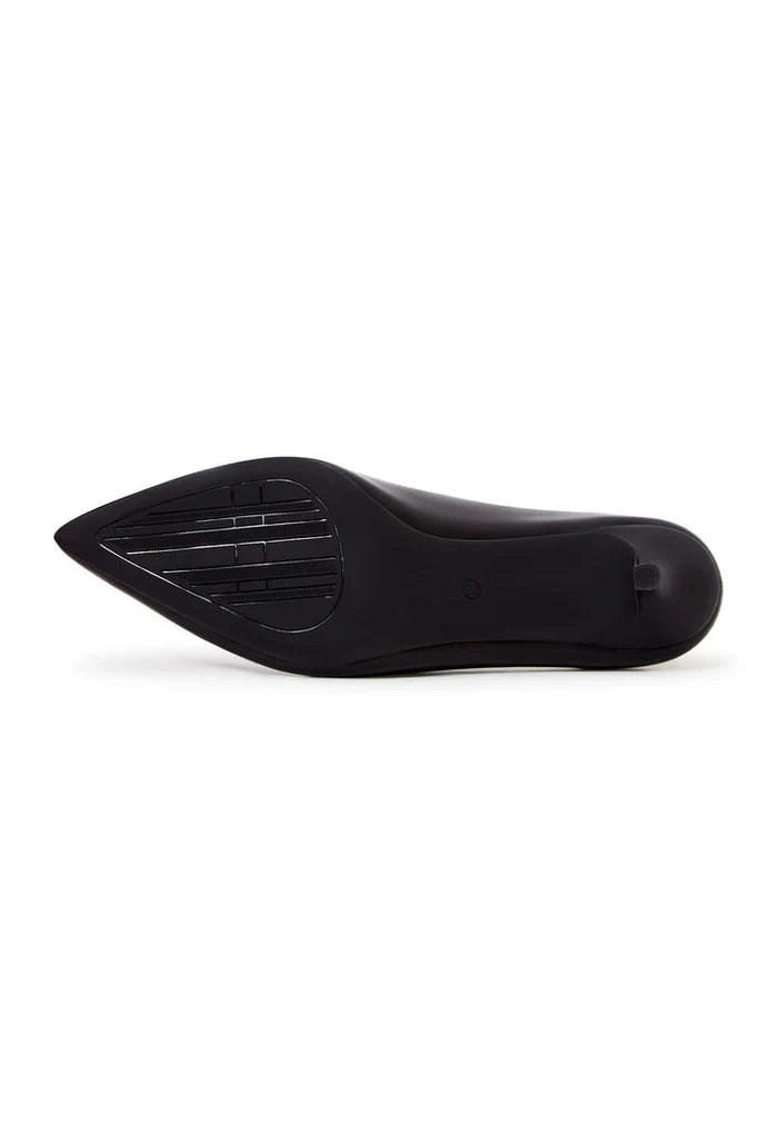 A pair of elegant luxe black pumps, a symbol of luxury footwear and designer heels, offering classic style.