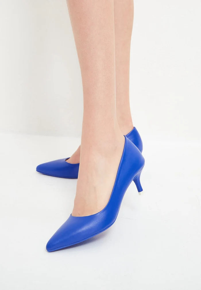 A pair of elegant blue designer pumps, the epitome of high-end footwear luxury.