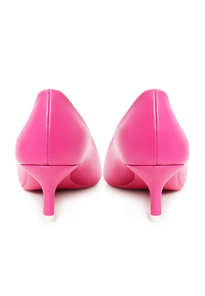 Elevate your style with these stunning fuchsia high-end women's pumps, the epitome of elegant and luxe footwear.