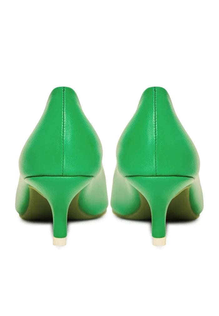 A pair of luxurious green pumps, elegant designer heels, high-end footwear for stylish dress shoes enthusiasts.