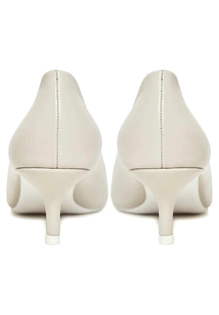 A pair of elegant off white pumps, perfect luxe heels for a designer touch or as white wedding heels.