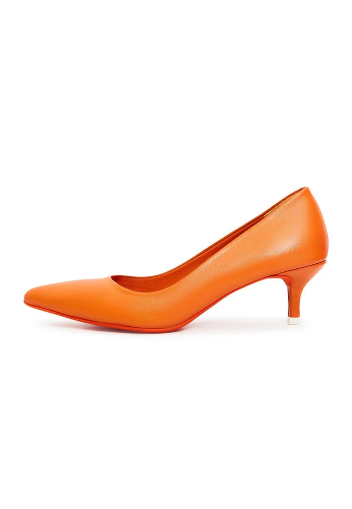 A pair of elegant orange designer pumps, high-end footwear showcasing luxury heels.