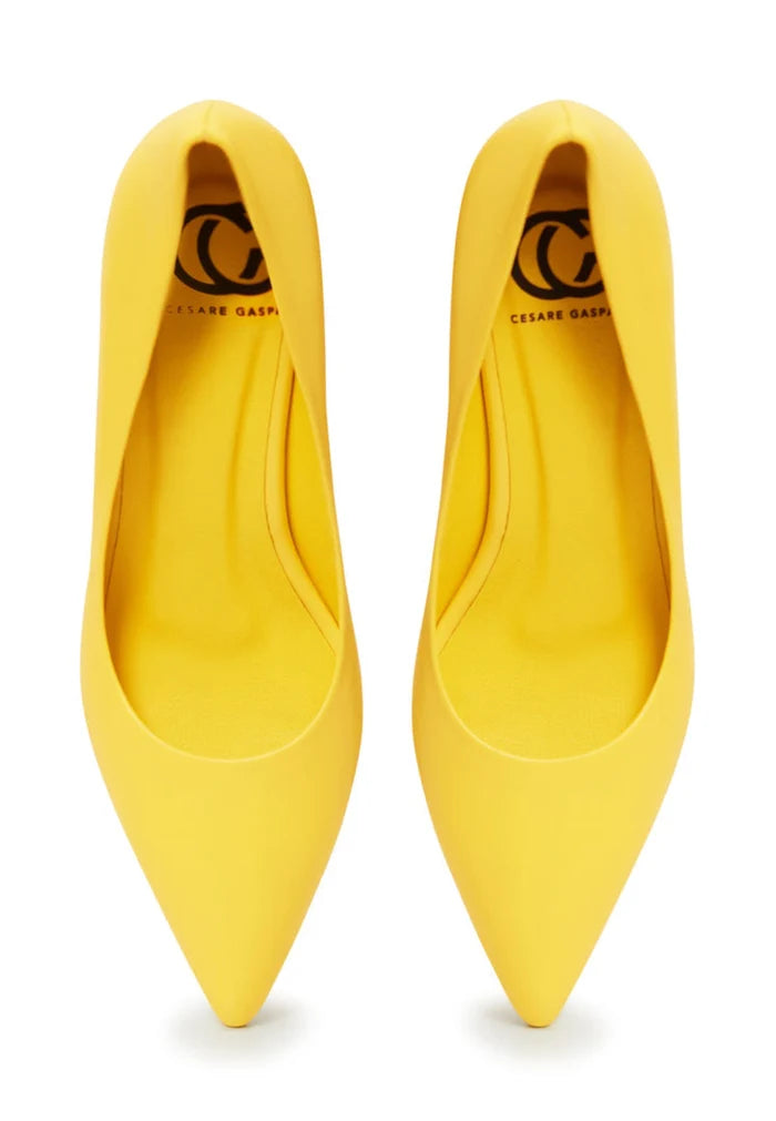 A pair of stunning yellow luxury pumps, the epitome of elegant footwear with designer heels, representing high-end shoes.