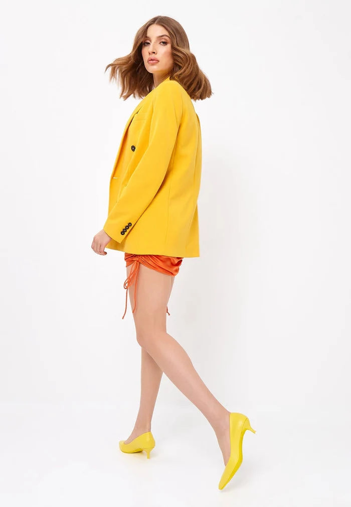 A pair of luxurious yellow pumps, perfect for those searching for elegant, designer heels and high-end shoes.