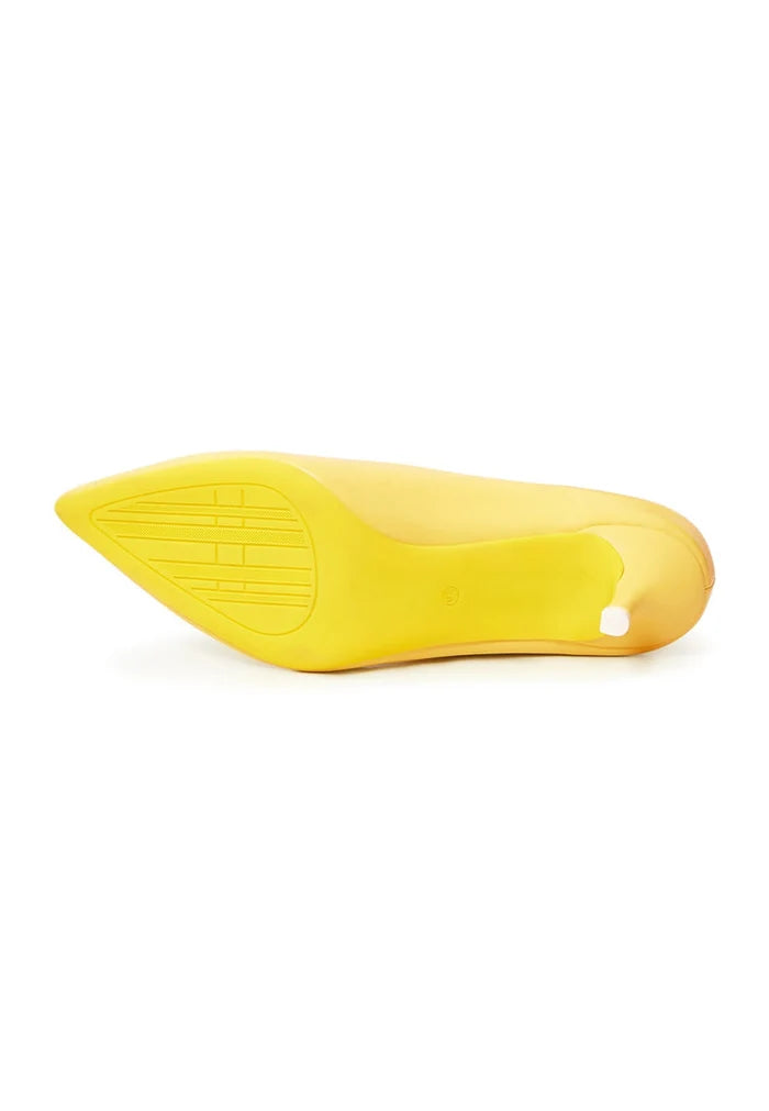 A pair of luxurious yellow pumps, the epitome of elegant footwear, perfect for any designer heels collection of high-end shoes.