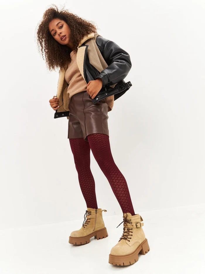 A pair of elegant beige platform ankle boots, the perfect stylish addition to any women's fashion footwear collection.