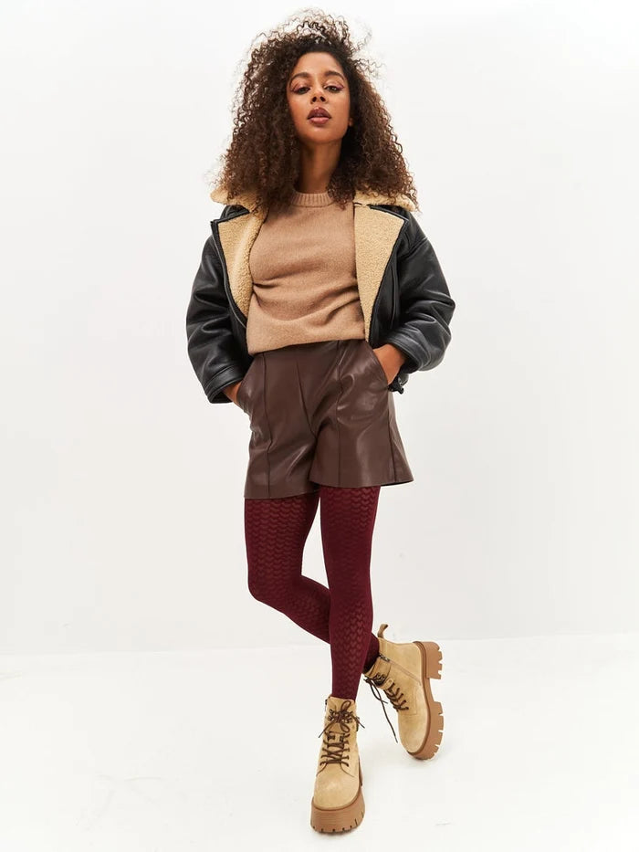 A pair of beige platform ankle boots, the epitome of stylish women's fashion footwear.